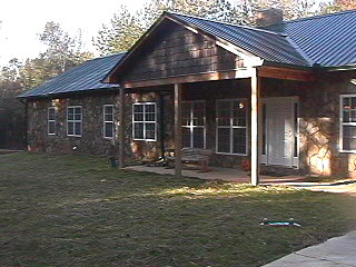 One Level Above Ground W/Cedar Siding and Carnace